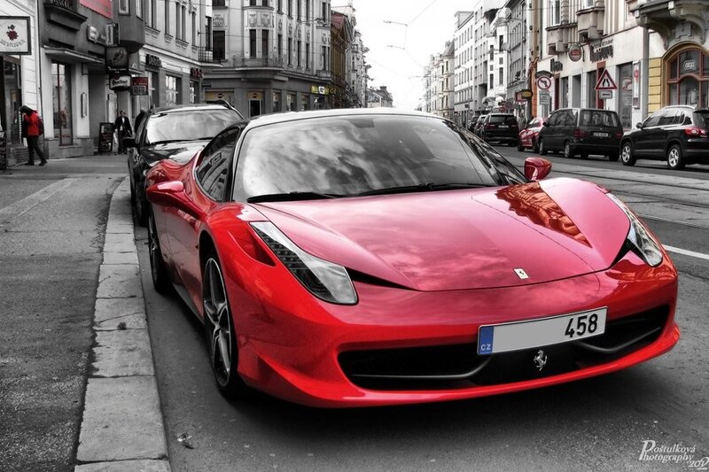 Red Ferrari on city street