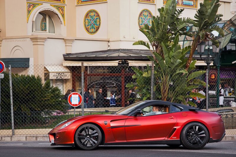 Red Ferrari on city street