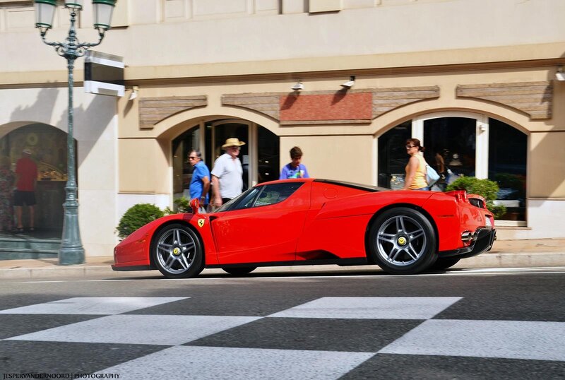 Red Ferrari on city street