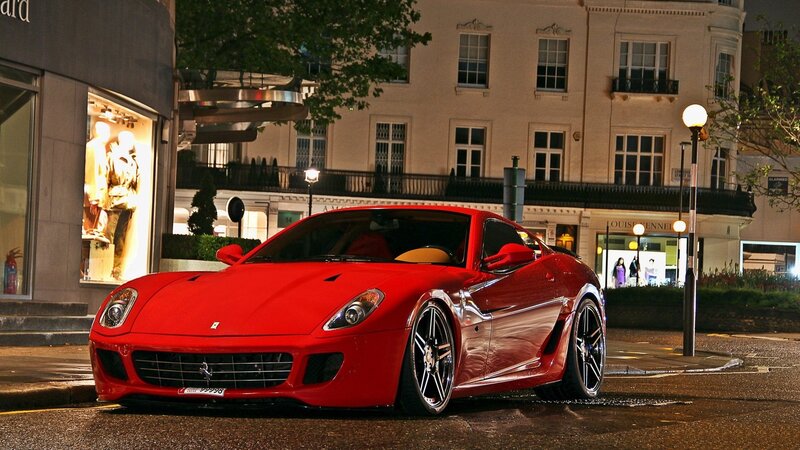 Red Ferrari on city street