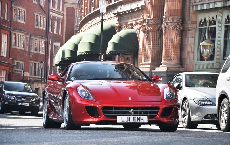 Red Ferrari on city street
