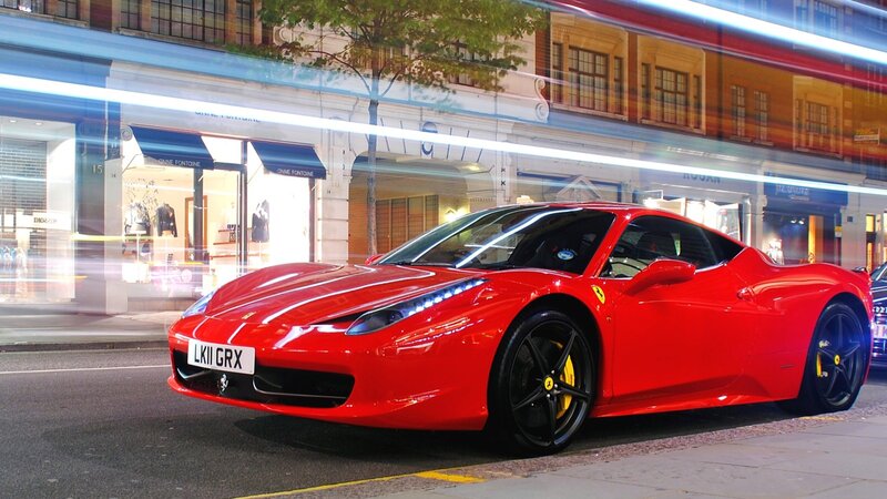 Red Ferrari on city street