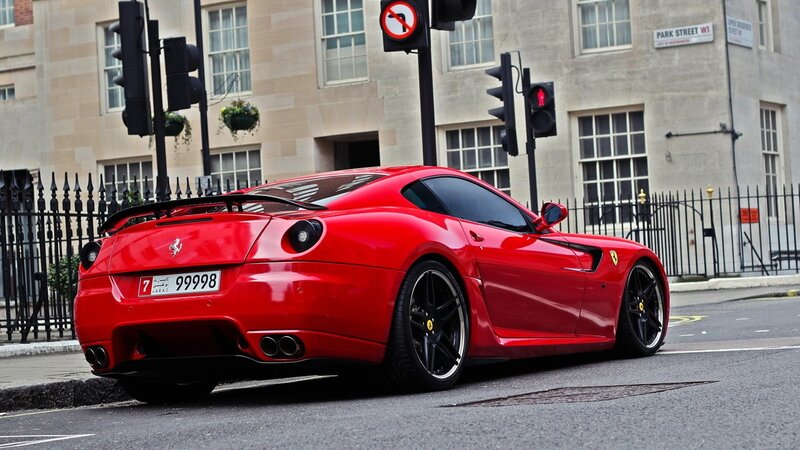 Red Ferrari on city street