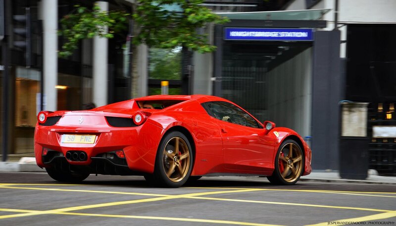 Red Ferrari on city street
