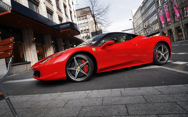 Red Ferrari on city street