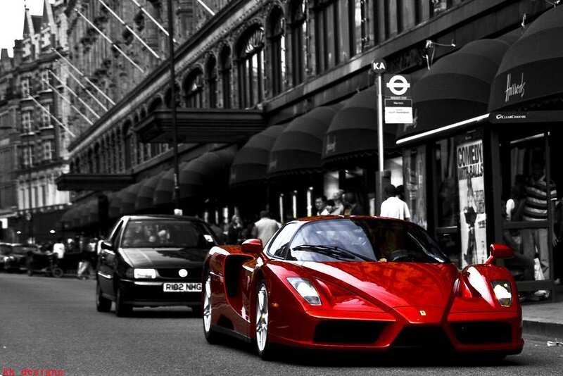 Red Ferrari on city street