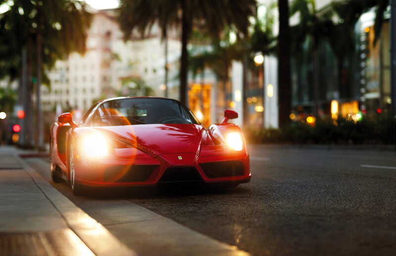 Red Ferrari on city street