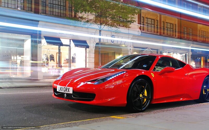 Red Ferrari on city street