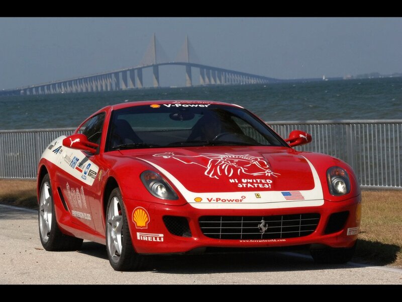 Red Ferrari on coastal road