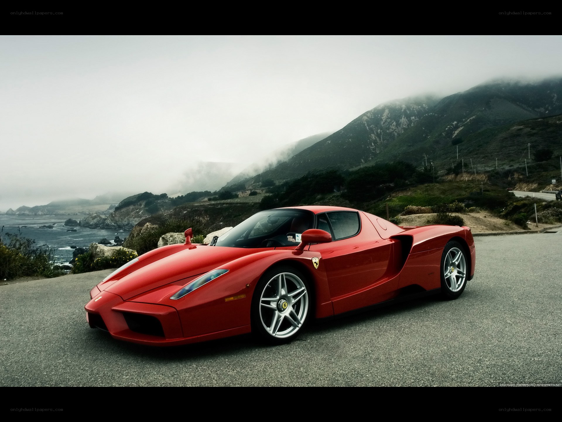 Red Ferrari on coastal road
