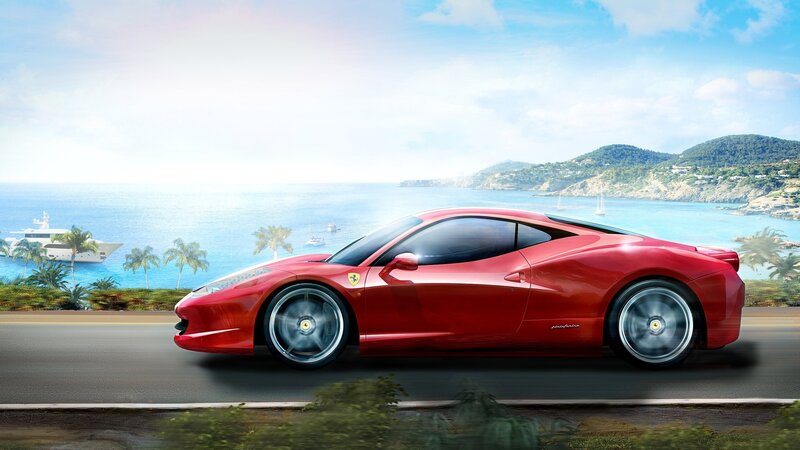 Red Ferrari on coastal road