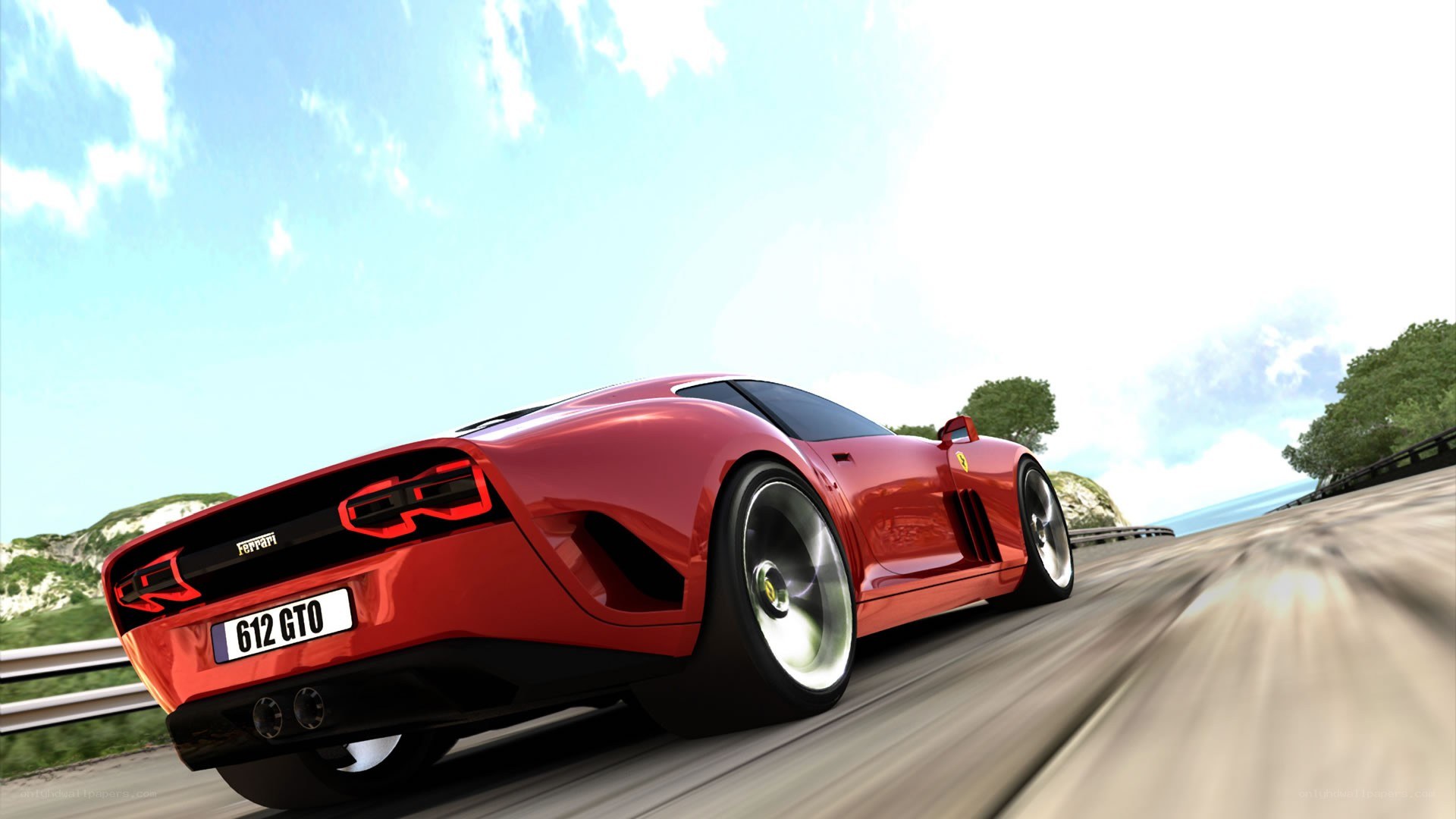 Red Ferrari on coastal road
