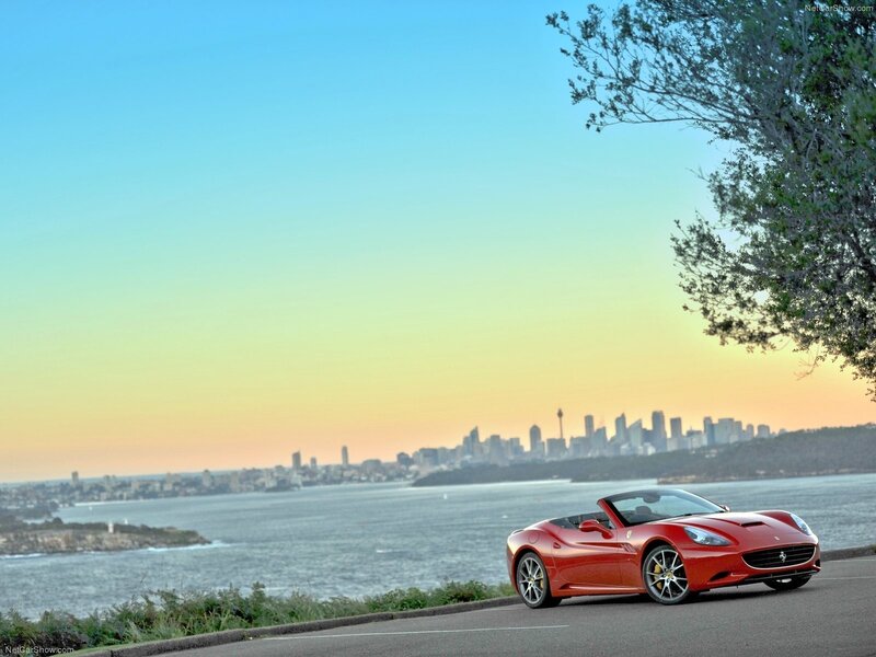 Red Ferrari on coastal road