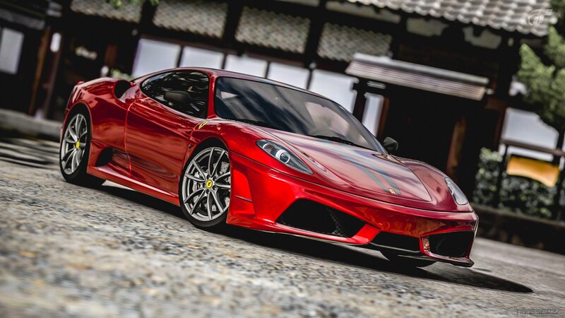 Red Ferrari on cobblestone street