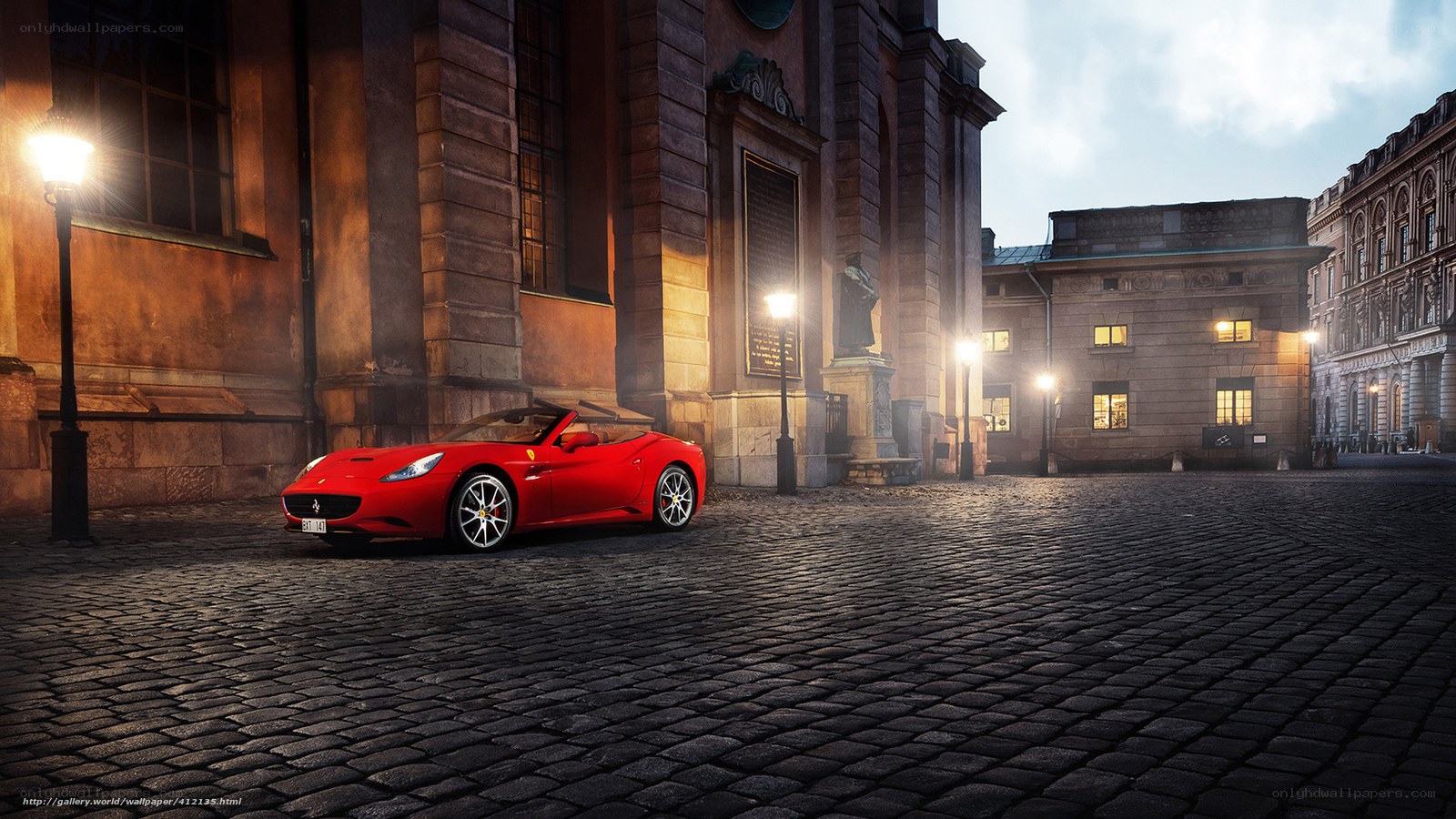 Red Ferrari on cobblestone street