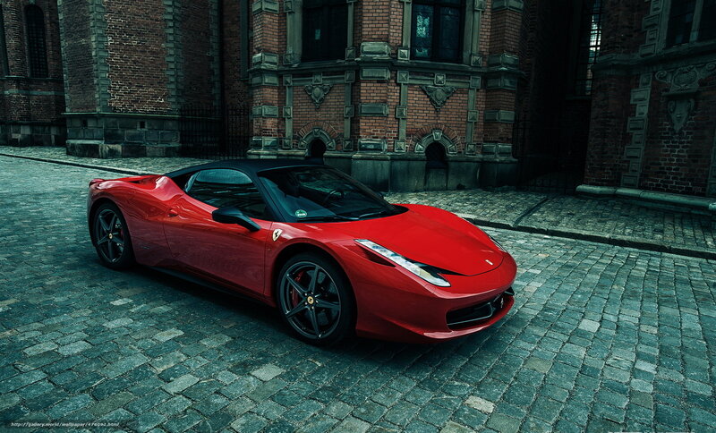 Red Ferrari on cobblestone street