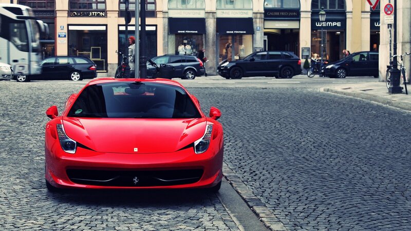 Red Ferrari on Cobblestone