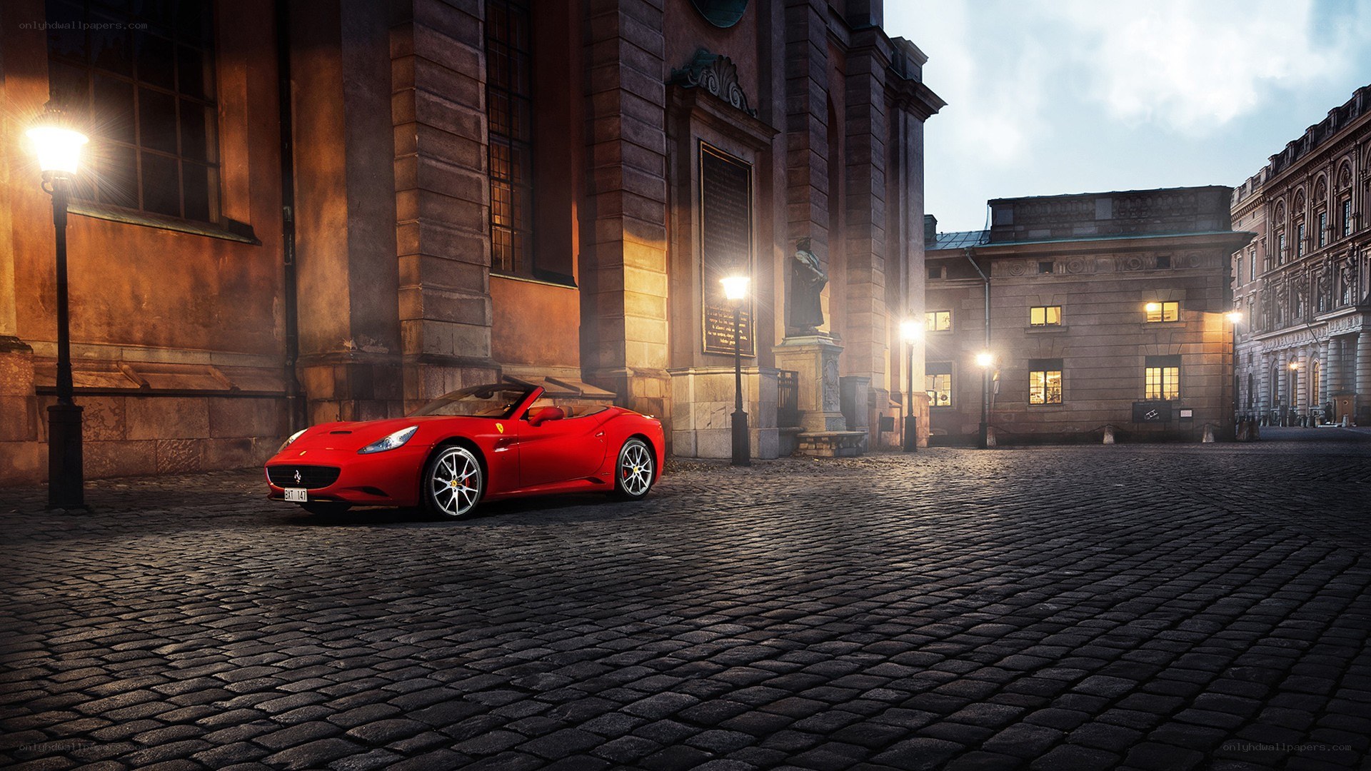 Red Ferrari on cobblestones