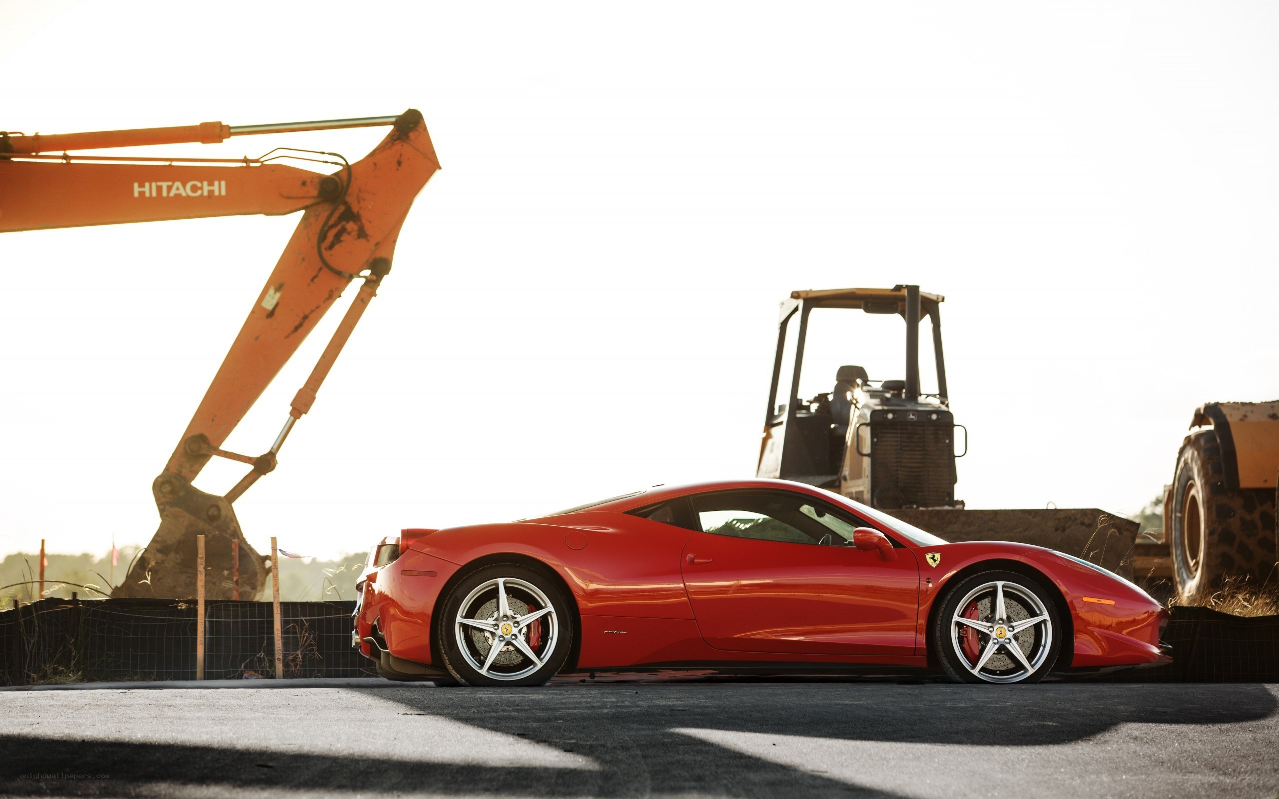 Red Ferrari on construction site