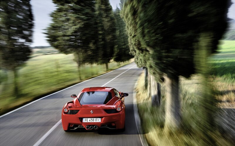 Red Ferrari on country road