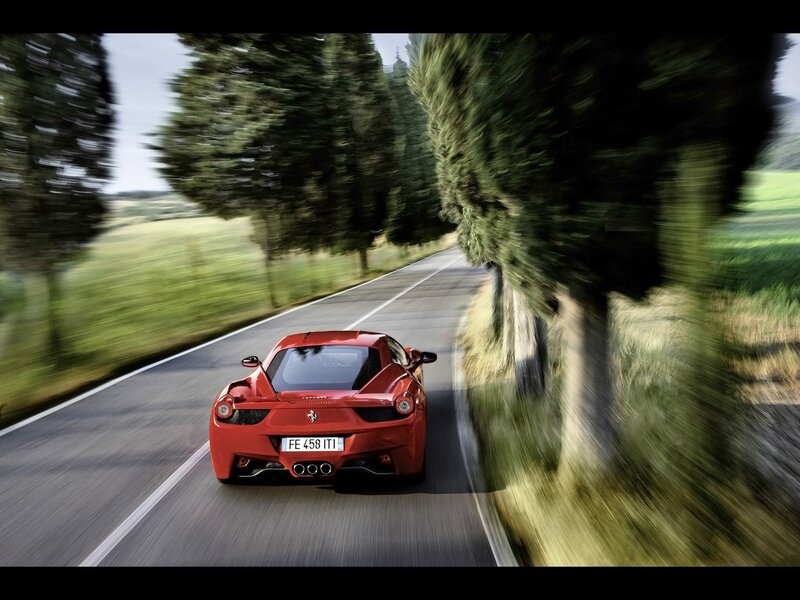 Red Ferrari on country road