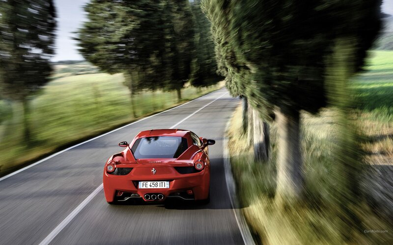 Red Ferrari on country road