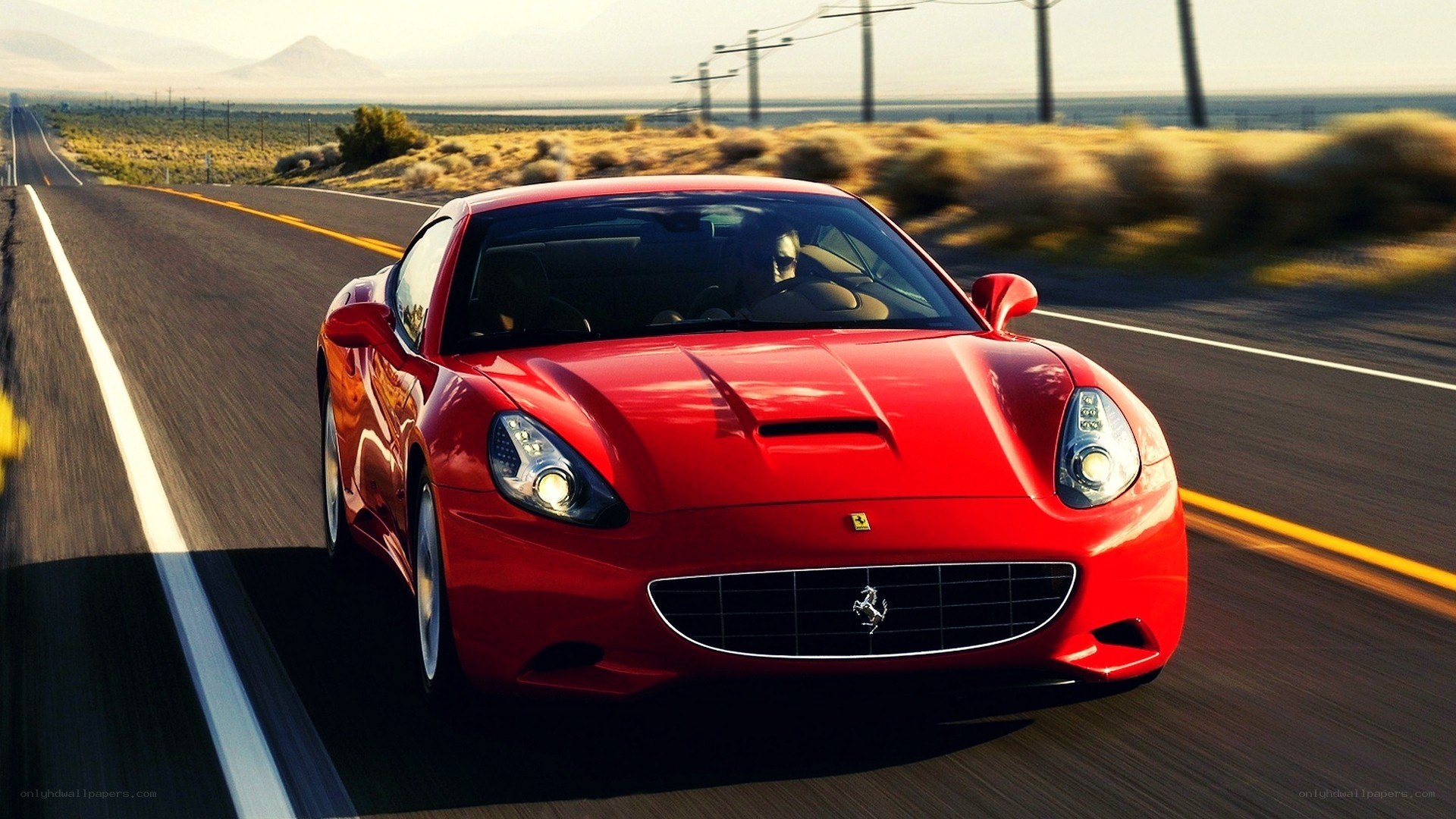 Red Ferrari on desert road