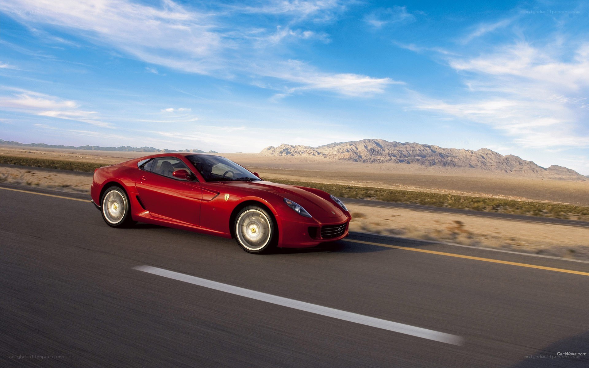 Red Ferrari on desert road