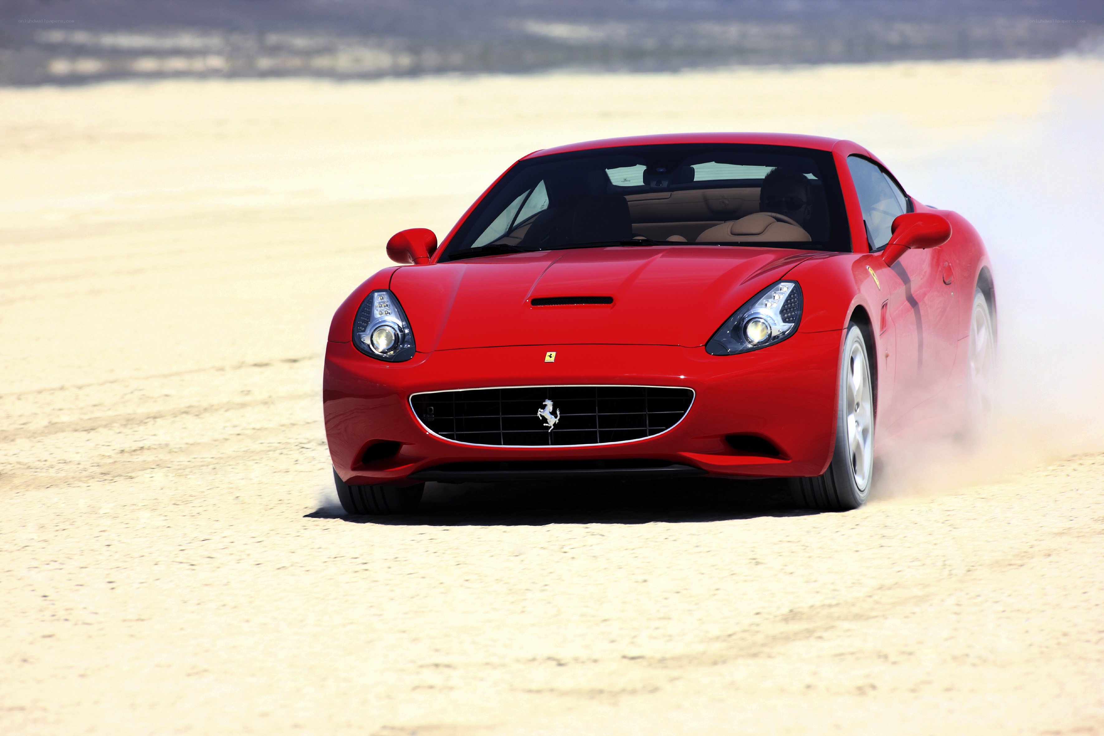 Red Ferrari on desert track