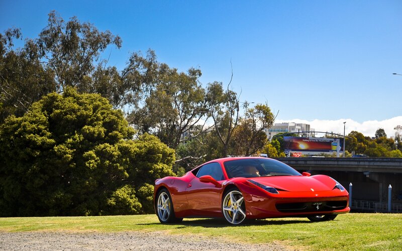Red Ferrari on Grass — Bright, Sunny