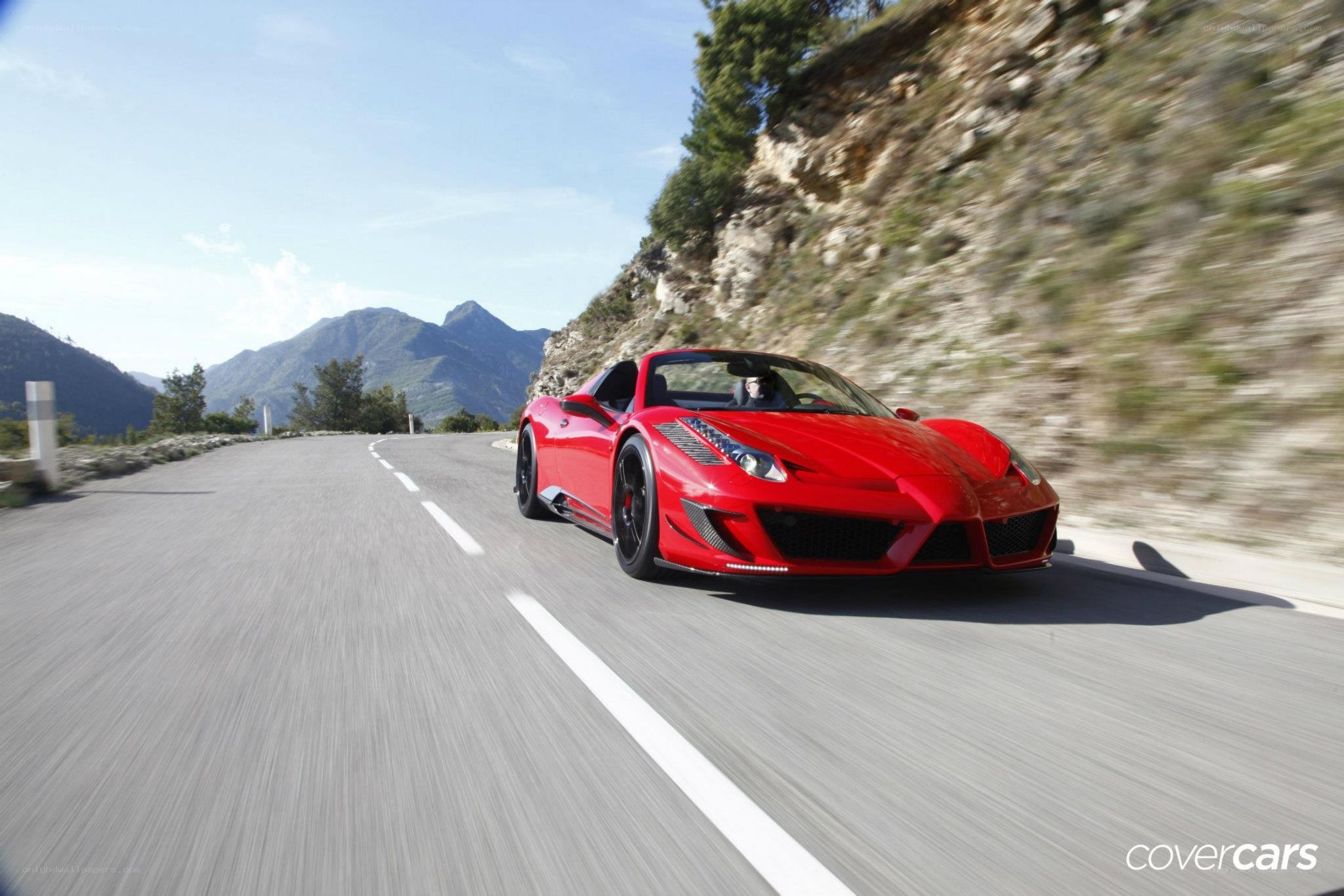 Red Ferrari on mountain road