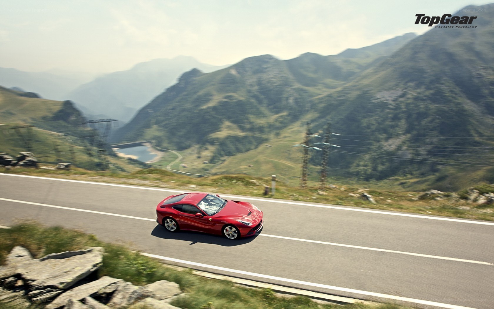 Red Ferrari on mountain road