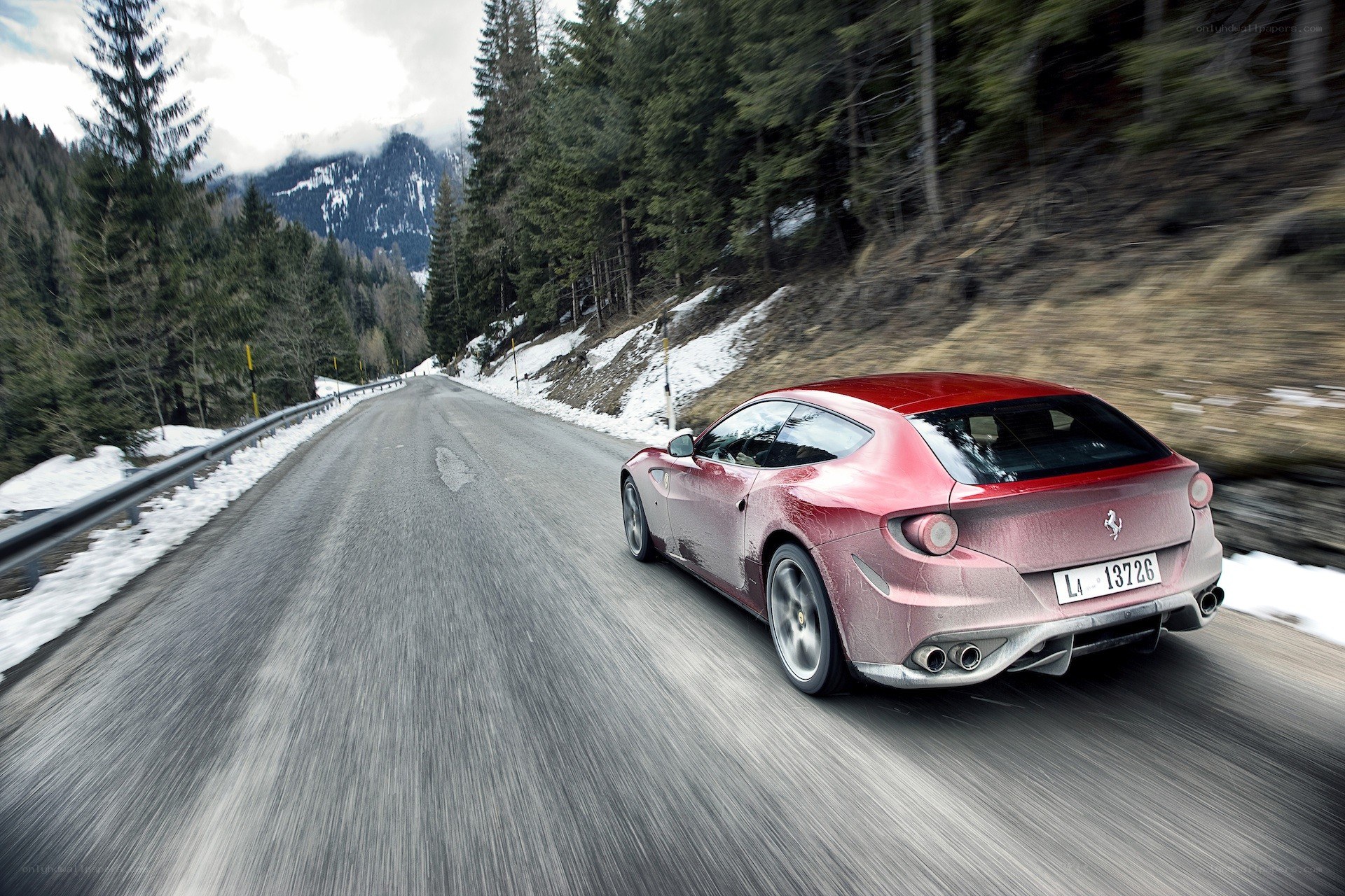 Red Ferrari on mountain road