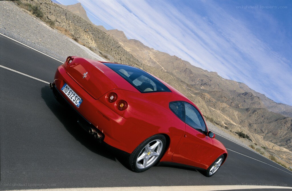 Red Ferrari on mountain road