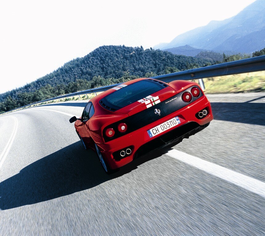 Red Ferrari on mountain road