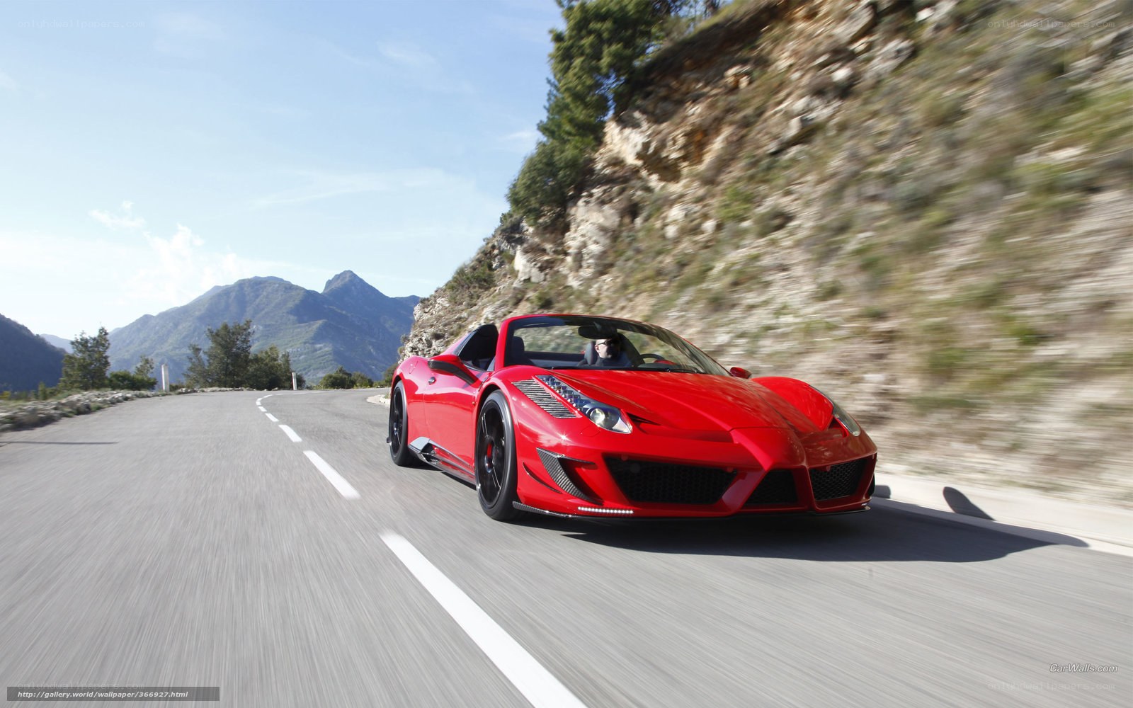 Red Ferrari on mountain road