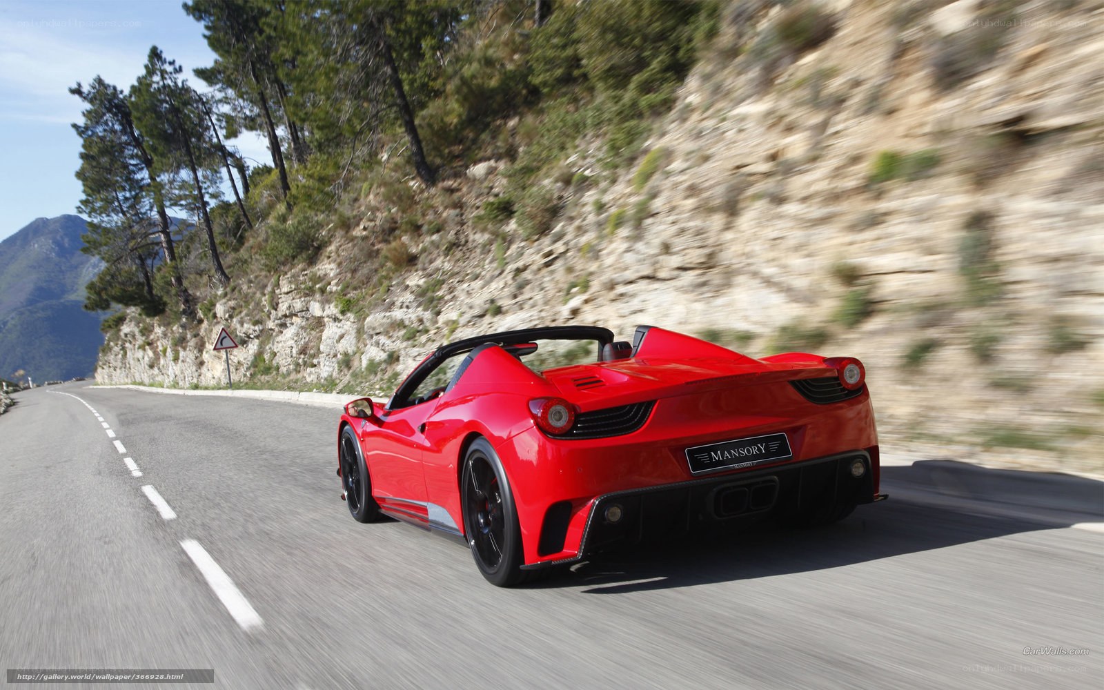 Red Ferrari on mountain road