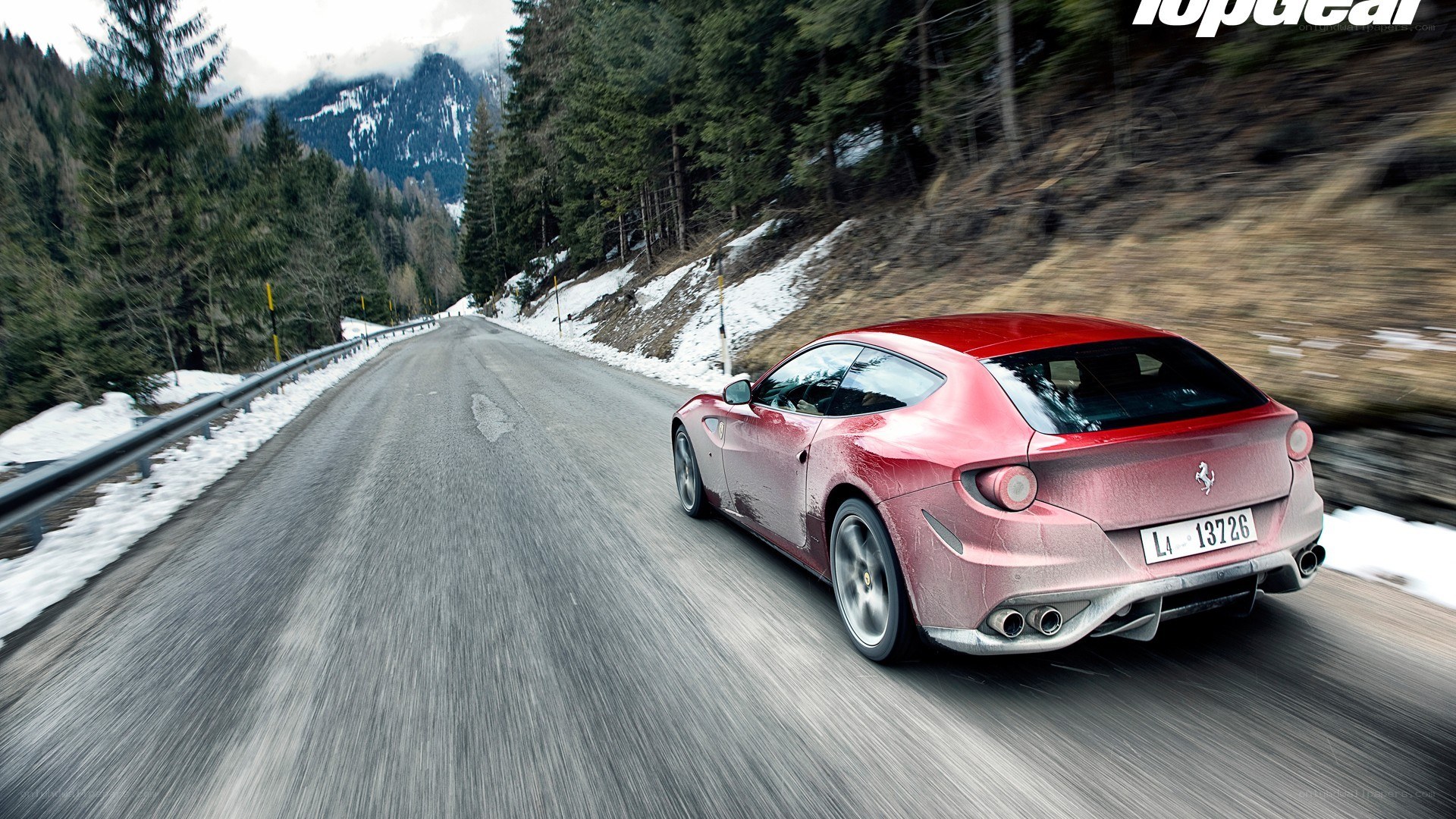 Red Ferrari on mountain road