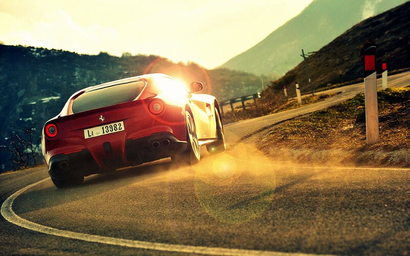 Red Ferrari on Mountain Road — Dynamic, Sunset