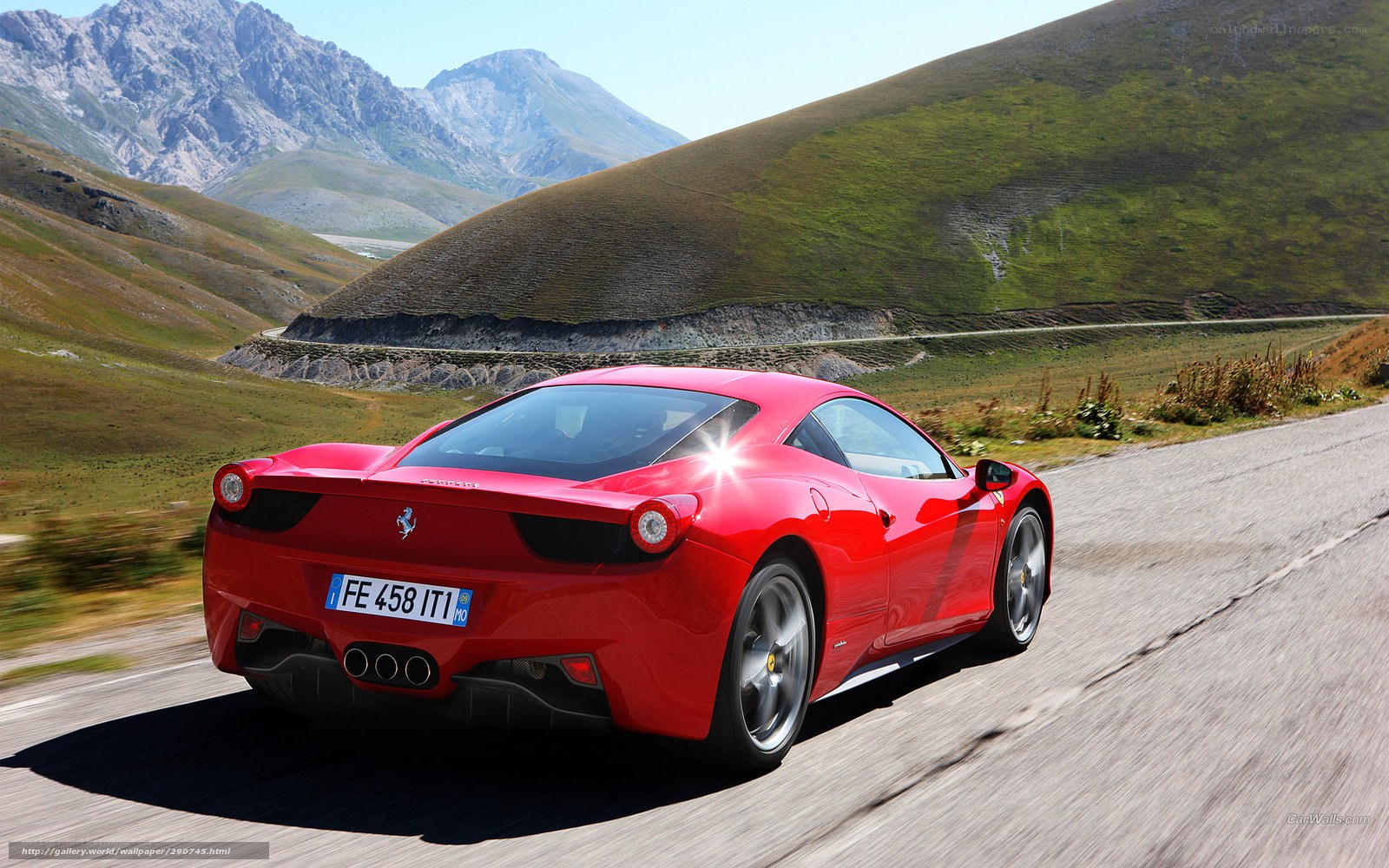 Red Ferrari on mountain road