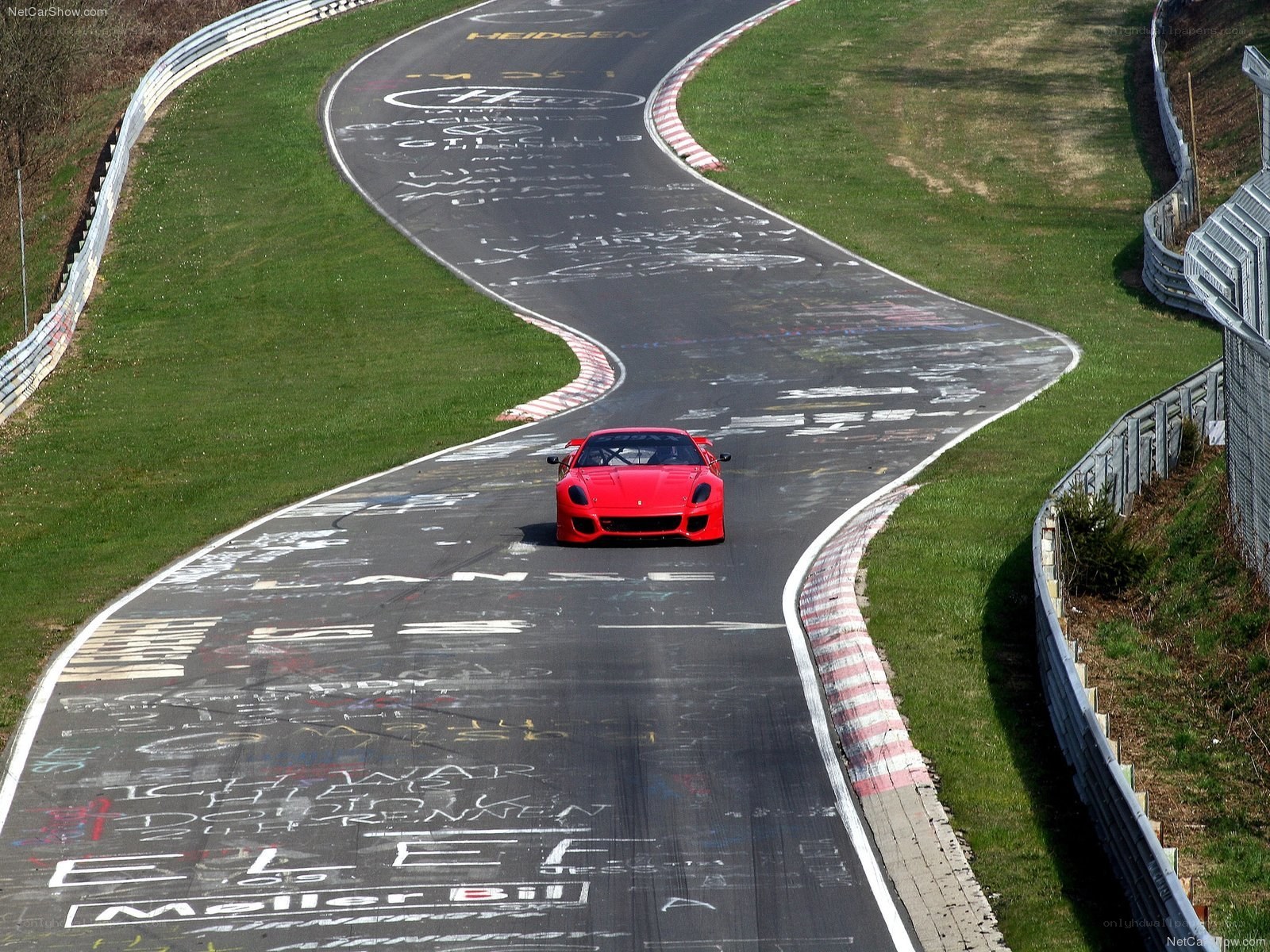 Red Ferrari on racetrack