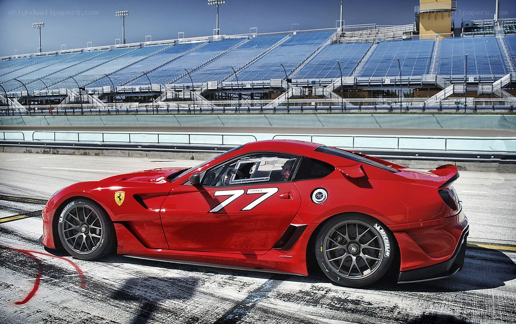 Red Ferrari on racetrack
