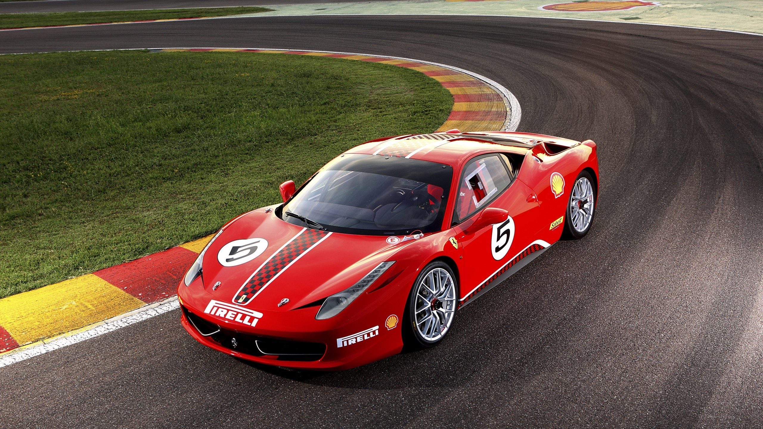Red Ferrari on racetrack