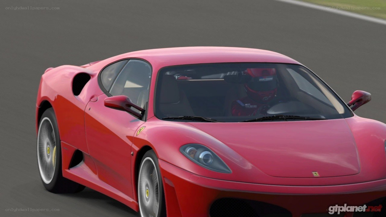 red ferrari on racetrack