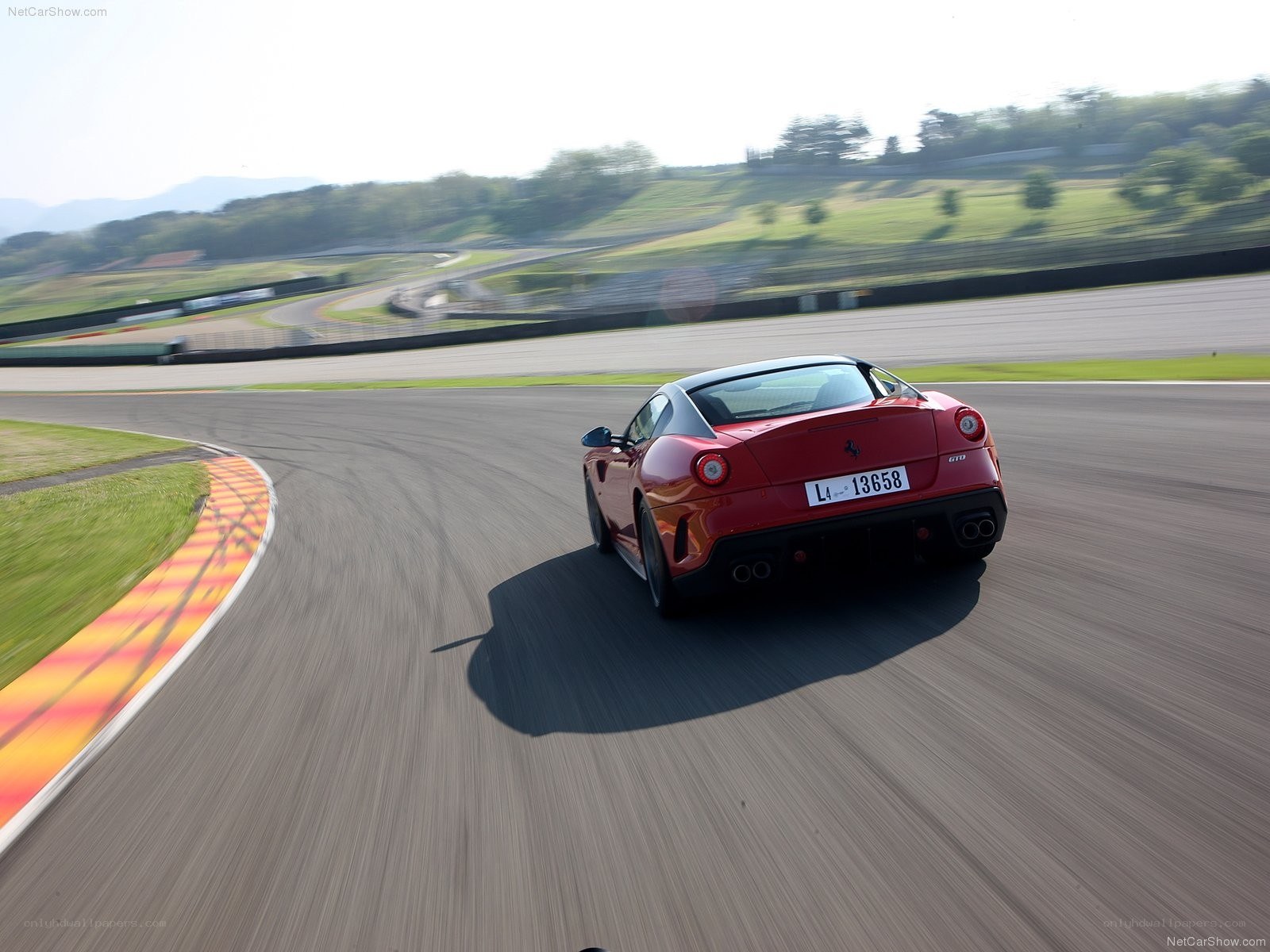 Red Ferrari on racetrack