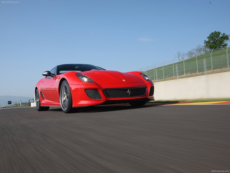 red ferrari on racetrack