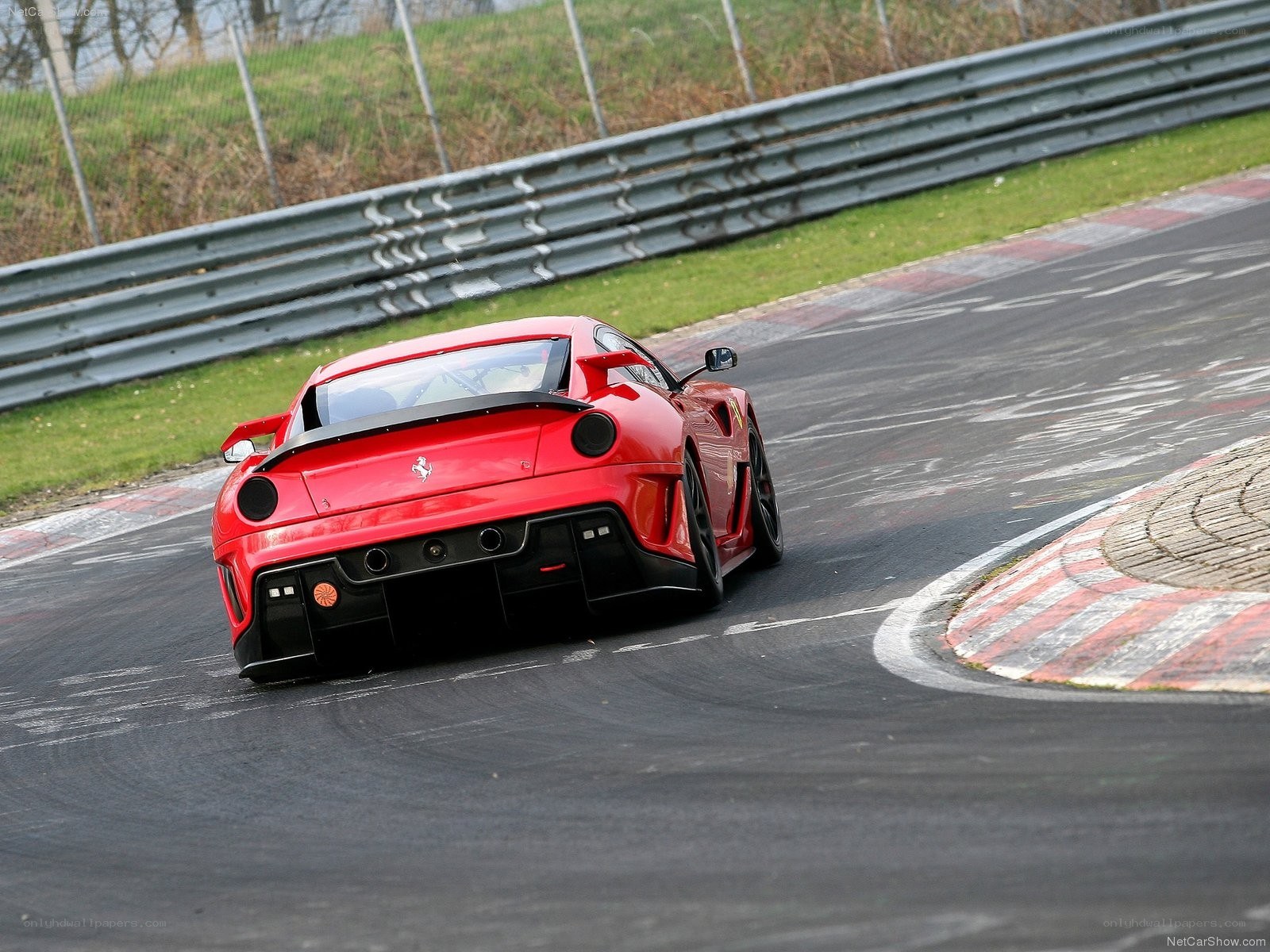 Red Ferrari on racetrack