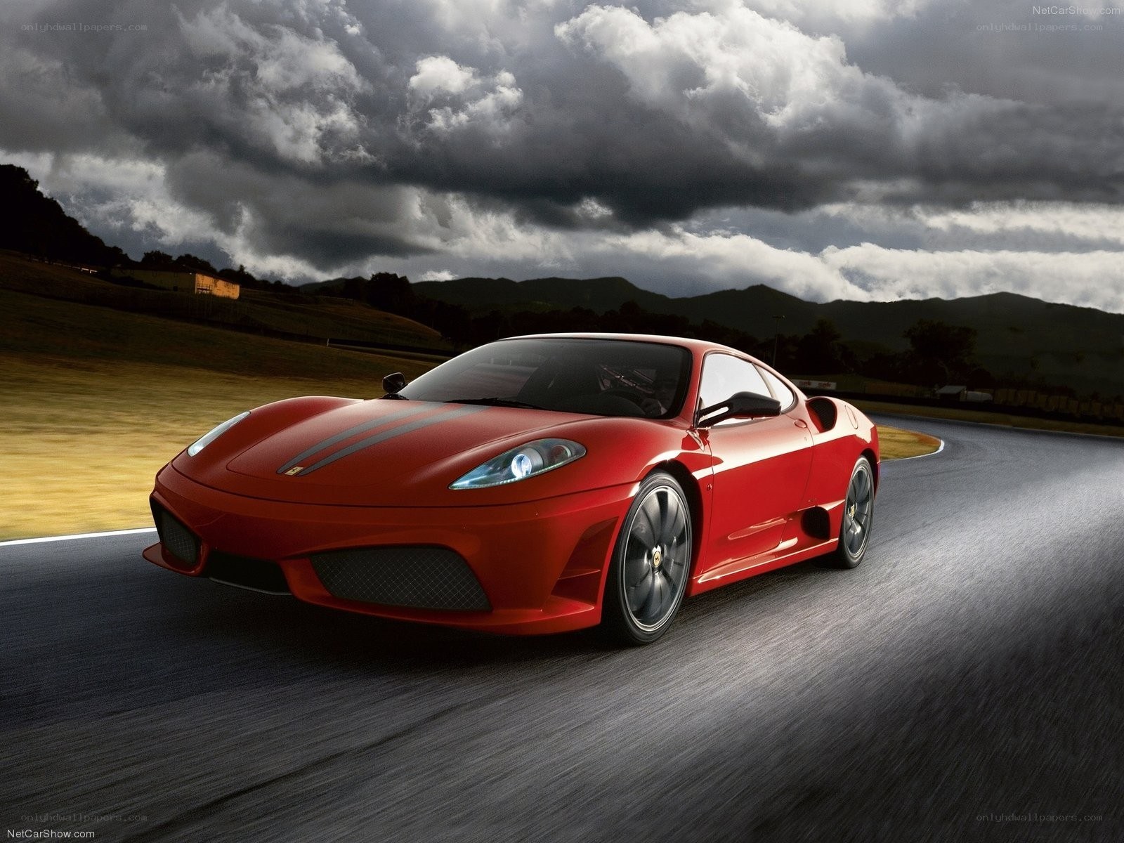 red ferrari on racetrack