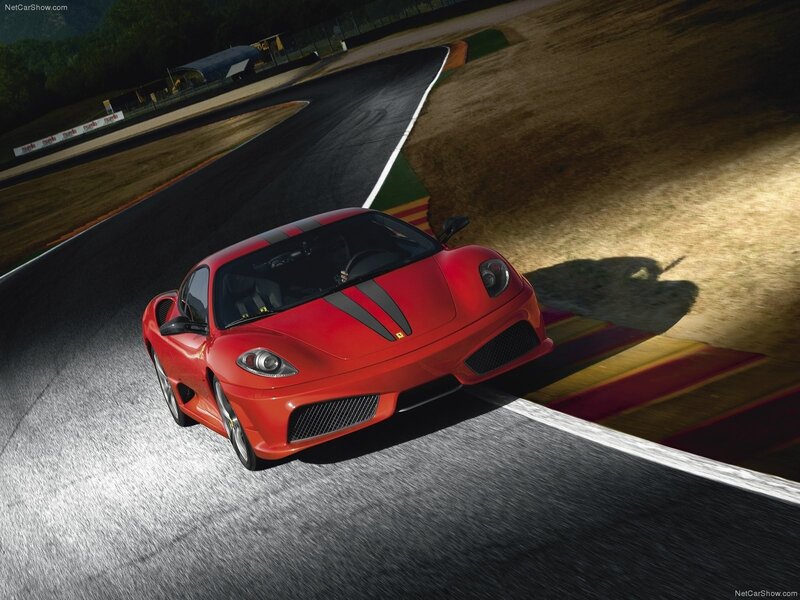 Red Ferrari on racetrack