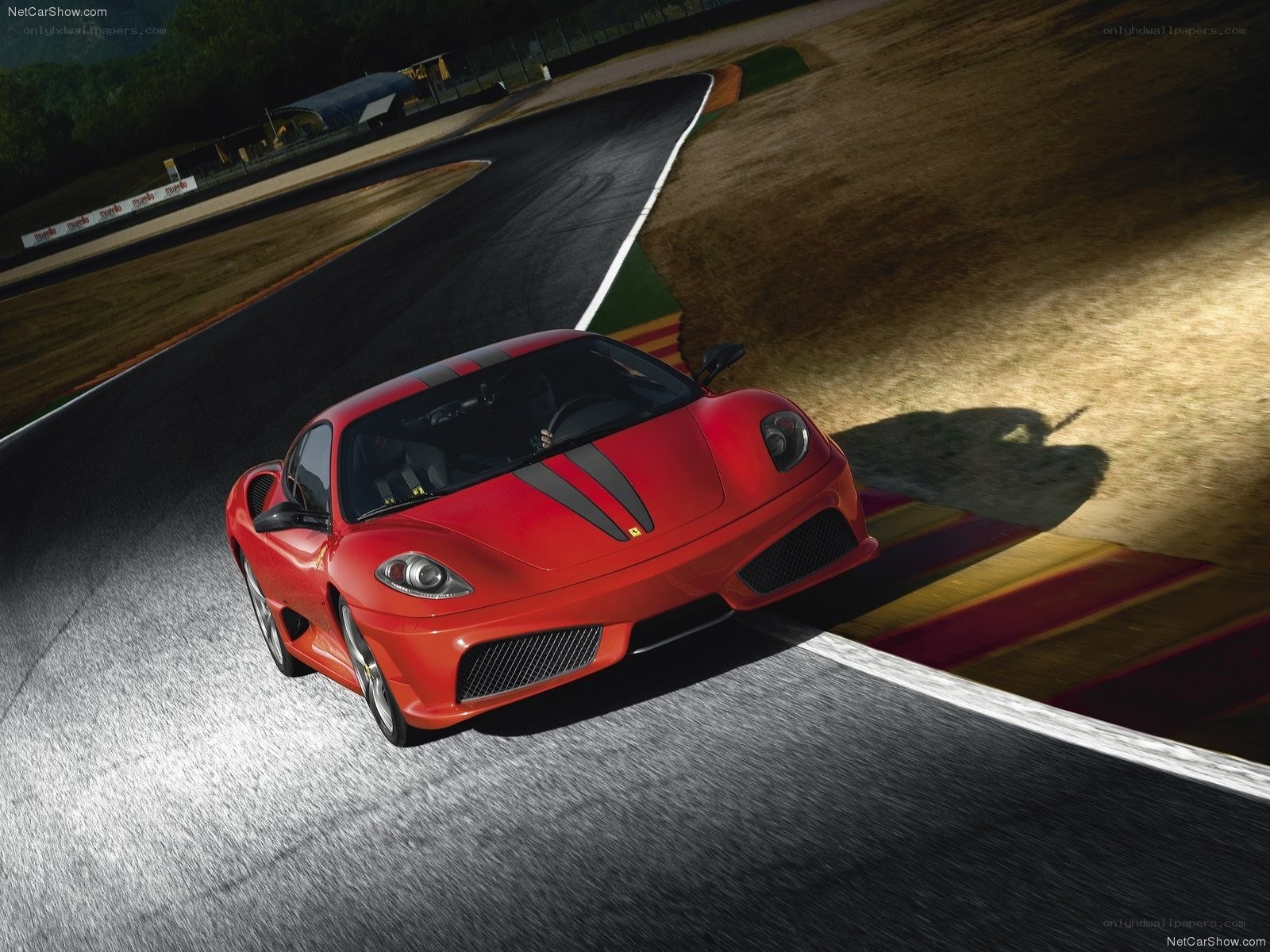Red Ferrari on racetrack
